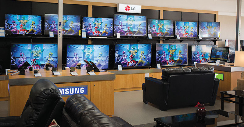 A wall of TVs is on display at Rent-A-Center