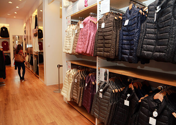 clothing is on display inside a Uniqlo store