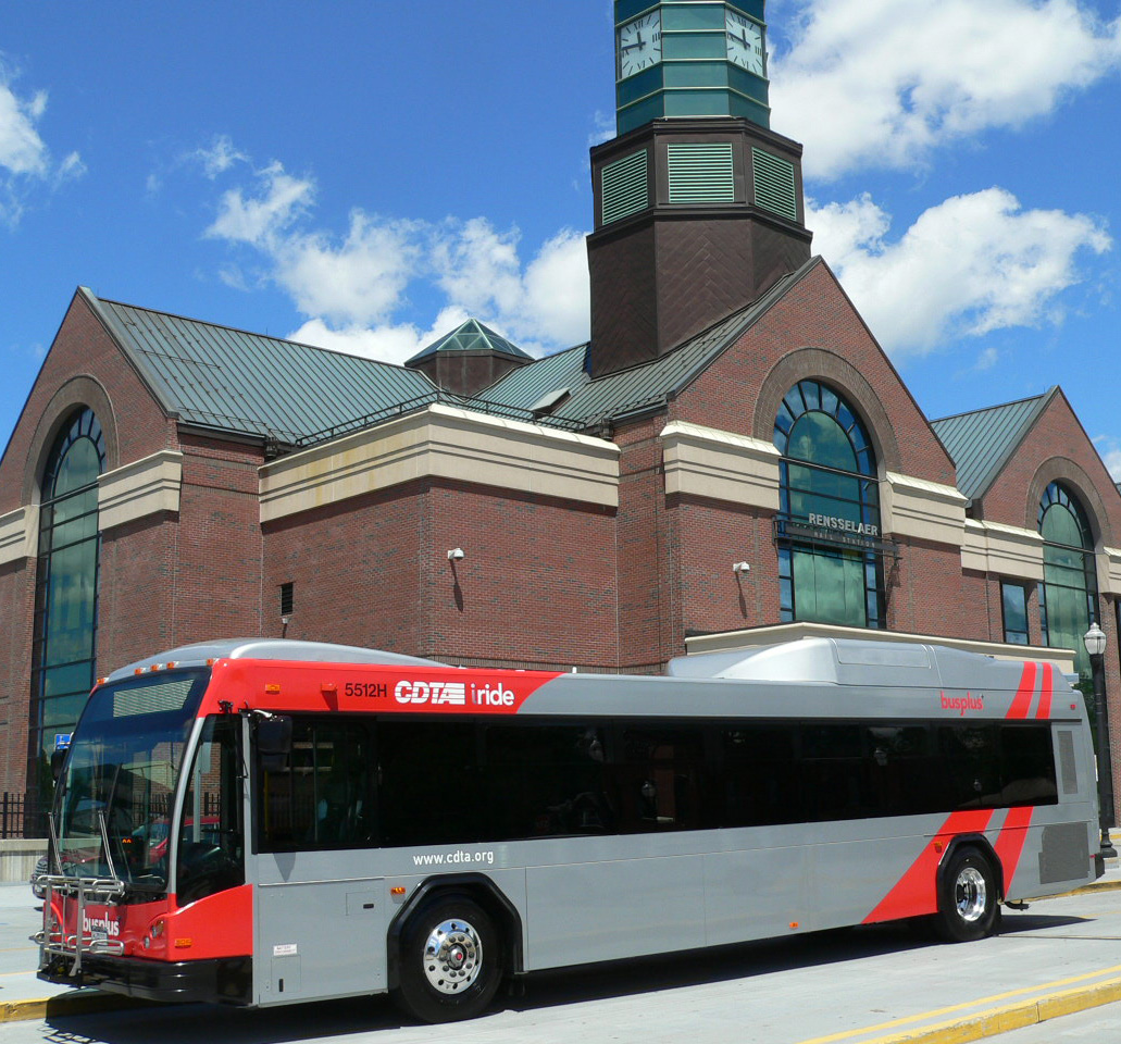 a Capital District Transportation Authority bus is parked at a curbside.