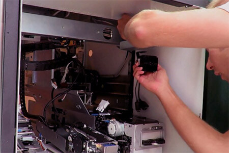 A man installing hardware in a server rack