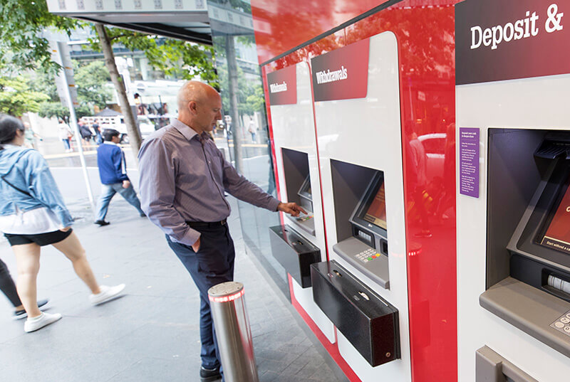 A man uses a Westpac New Zealand ATM machine