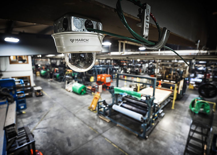A March Networks IP Camera is installed in the ceiling of a manufacturing plant.