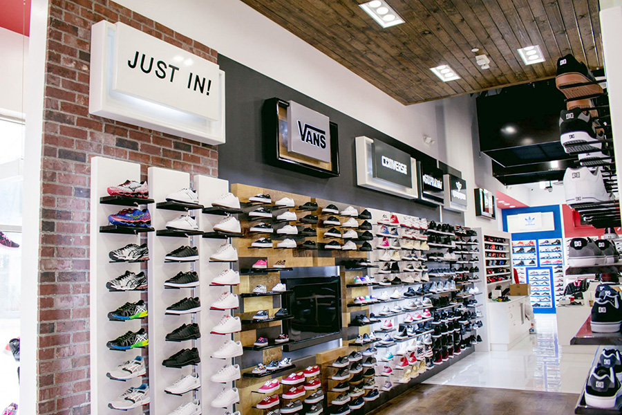 a display wall of athletic shoes in a Shoe Palace retail location