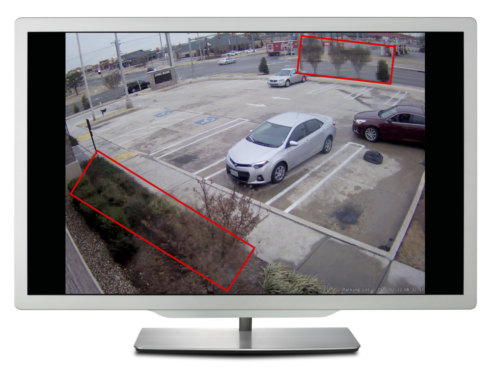 Computer monitor showing a parking lot with boxes drawn around the foliage to demonstrate Region of Interest compression being applied.