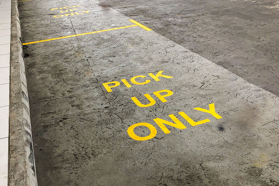 Empty parking spots that read ‘Food pick up only’