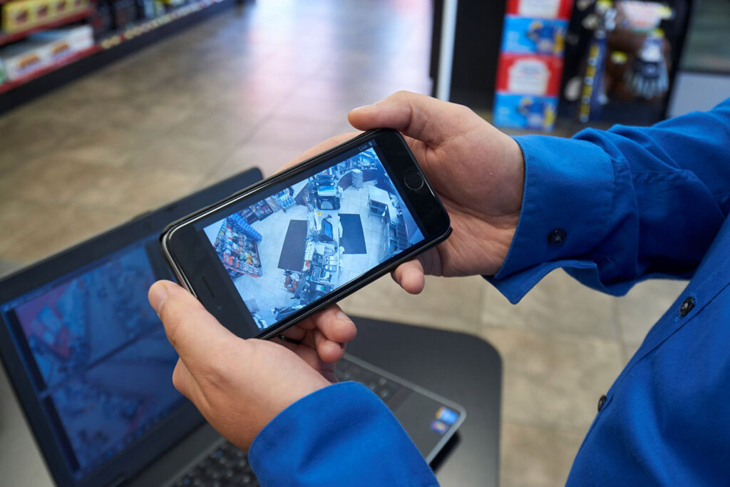 User viewing their convenience store surveillance footage using March Networks Command Mobile app on their smartphone