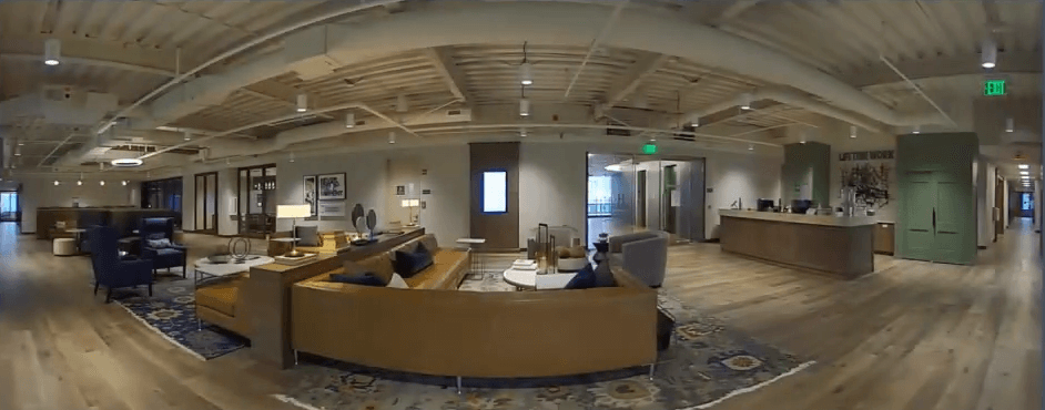 Panoramic camera view of office reception area.