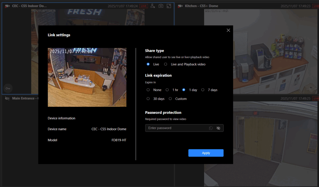 A software interface for video link settings. The center panel shows options for sharing type (Live or Live and Playback video), link expiration (None, 1 hour, 1 day, 7 days, 30 days, or custom), and password protection. On the left, device information is displayed: “Device name: CEC - CSS Indoor Dome” and “Model: FD819 HT.” In the background, there are surveillance camera feeds showing different indoor areas: a convenience store counter with snacks and drinks, a break room with coffee machines and supplies, and a hallway with double doors.