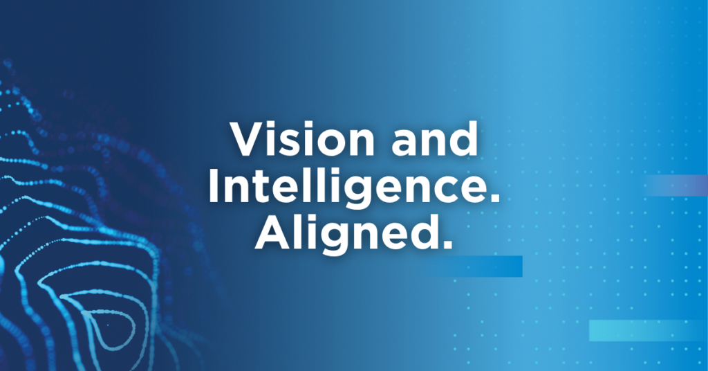 Blue gradient background with abstract dotted patterns and curved line art, featuring the white text “Vision and Intelligence. Aligned.” centered on the image, representing March Networks and VIVOTEK merger.