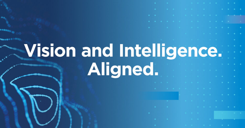Blue gradient background with abstract dotted patterns and curved line art, featuring the white text “Vision and Intelligence. Aligned.” centered on the image, representing March Networks and VIVOTEK merger.