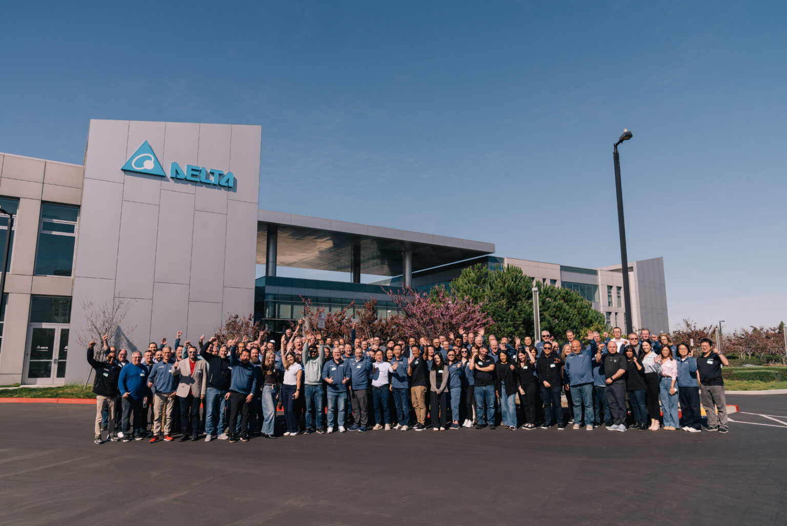 Delta corporate office exterior with the March Networks and VIVOTEK team group photo outside the corporate headquarters building